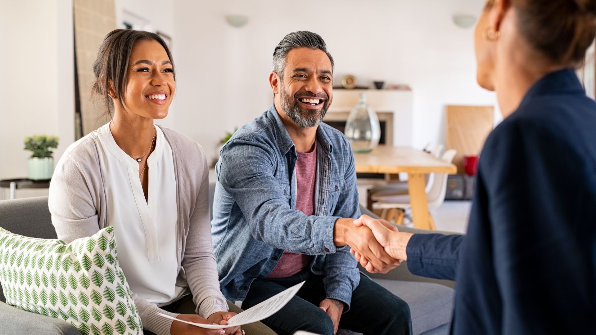Website%20Dev.%20-%202025-05-27T160720.188 smiling couple shaking hands with a tax professional